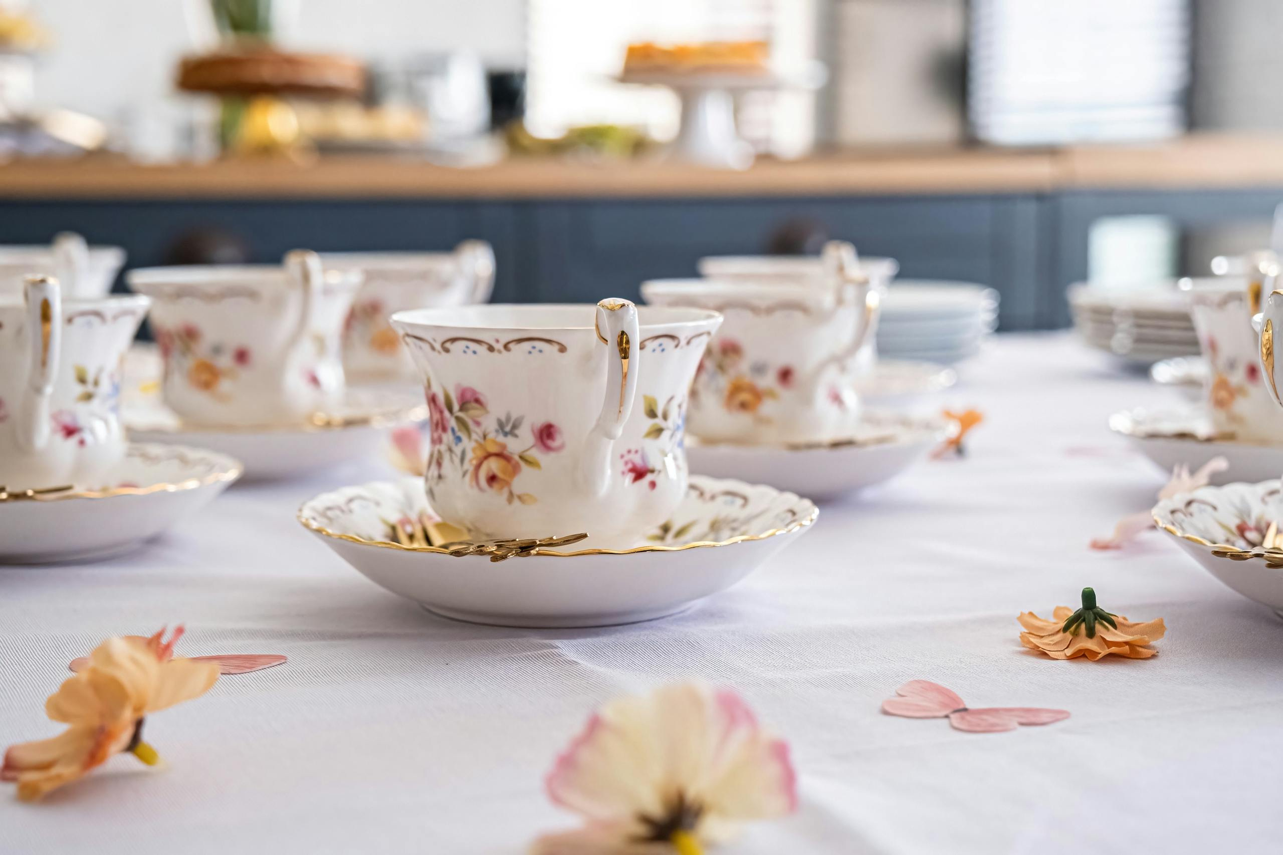 Delicate floral china cups elegantly set up for a tea party